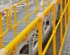 Ball joint handrail system installed on industrial walkway platform for safety and fall protection